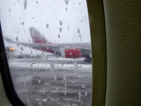 the machine washes the airplane with de-icerの写真素材