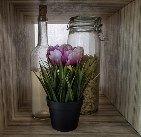 Various uncooked cereals, grains, beans and pasta for healthy cooking in glass jarsの写真素材