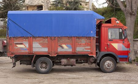 Retro car in Europe. Summer village landscape with road and car. Road trip journey.の写真素材