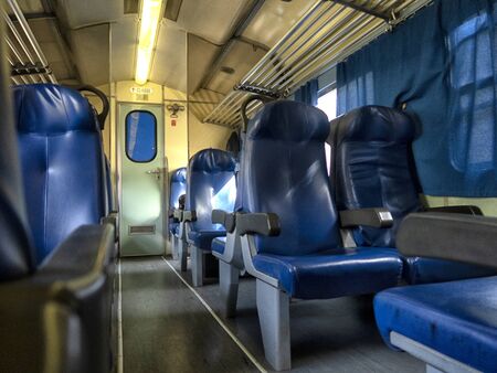 View inside the carriage of a passenger train on the railway. Railway transport.の写真素材