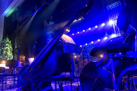Contrabass on stage in front of an empty hallの写真素材