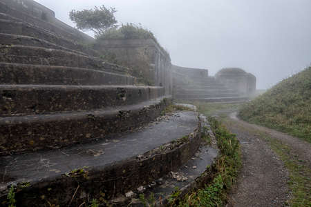 Old abandoned bunker in the woods. Military Fort. Fort number four, Vladivostok, Russia.