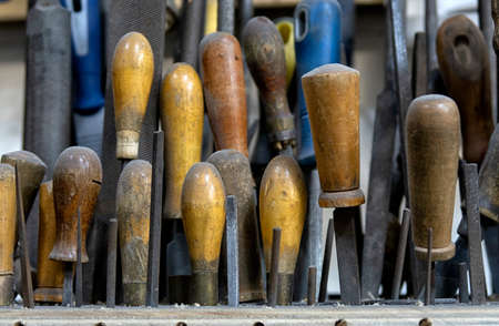 set of working tools on board background