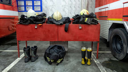 the uniform for firefighters close-up lies on the table and is ready to use.の写真素材