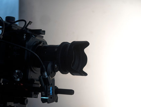 Professional digital video camera lens, studio recording equipment on details close up.