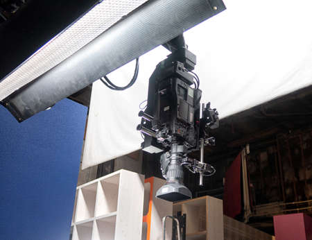 Professional digital video camera lens, studio recording equipment on details close up.