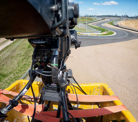 TV camera on the broadcast of motorcycle races. Professional digital video camera. accessories for...
