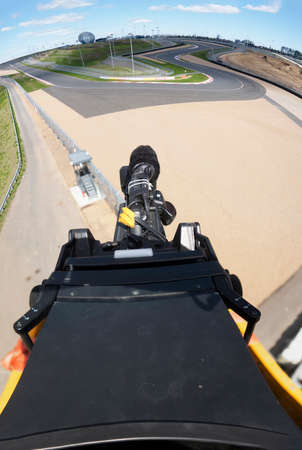 TV camera on the broadcast of motorcycle races. Professional digital video camera. accessories for...