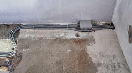 New electrical installation, socket and electrical cables on the wall, renovation conceptの写真素材