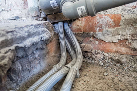 New electrical installation, socket and electrical cables on the wall, renovation conceptの写真素材