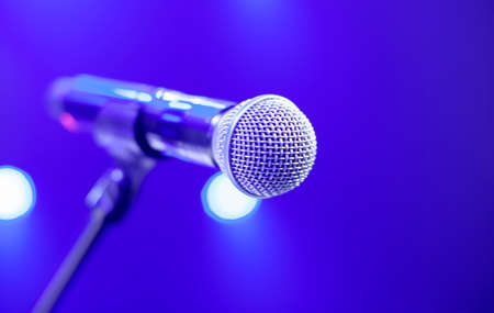 microphone on stage in the rays of lightの写真素材