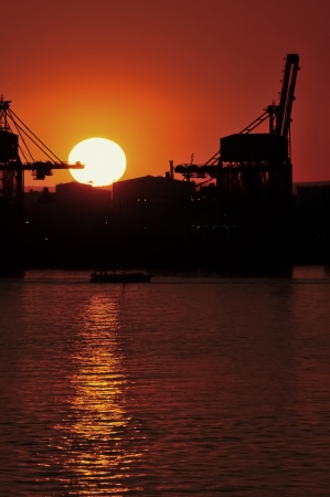 Sunset on the cargo port - Tarantoの写真素材