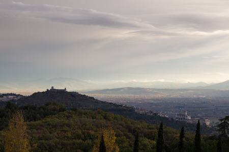 View of Assisi town from behind, with Francis church and Fortresの写真素材