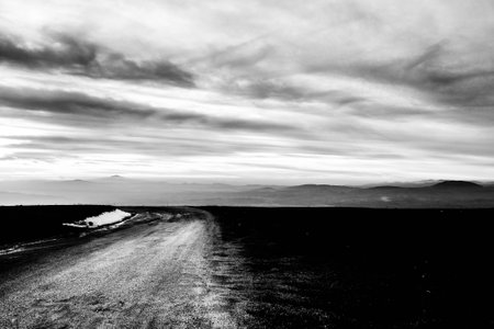 Subasio Mt. (Umbria, Italy), with sky covered by clouds and mist on the valley underneathの写真素材
