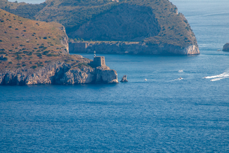 Beautiful aerial view of Capri island, with boat trails on the waterの写真素材