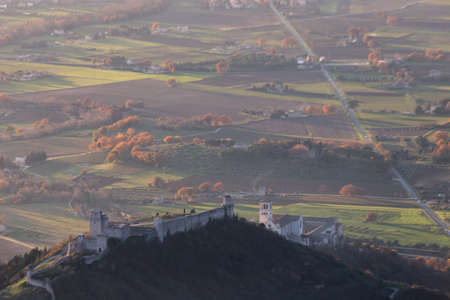 An aerial view of Assisi town, St.Francis church and Rocca Maggiore with country on the foregroundの写真素材
