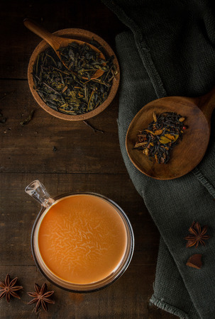 Chai tea latte on wooden background top viewの写真素材
