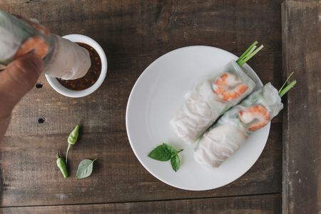 Fresh assorted Asian spring rolls set with shrimps, vegetables, fruits, copy spaceの写真素材