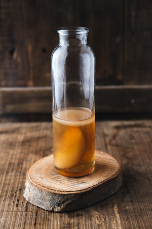 Homemade fermented raw kombucha tea. Healthy natural probiotic flavored drink.