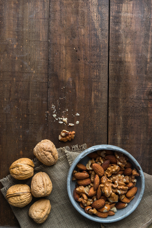 Almond and walnut on wooden backgroundの写真素材