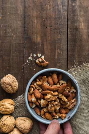 Almond and walnut on wooden backgroundの写真素材