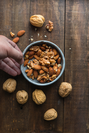 Almond and walnut on wooden backgroundの写真素材