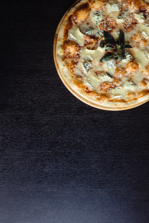 Italian pizza 4 cheese on the Boardの写真素材