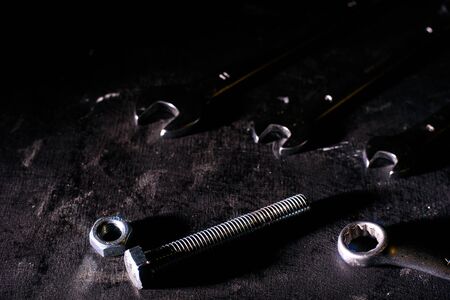 Wrench, bolt, nut isolate on black backgroundの写真素材