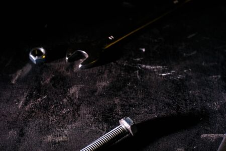 Wrench, bolt, nut isolate on black backgroundの写真素材