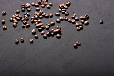 Coffee beans texture. Coffee in beans on dark background. Food background of coffee beans. Abstract background texture.の写真素材