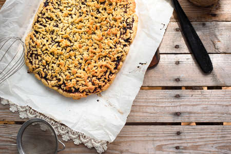 Graded pie with jam on a wooden tableの写真素材