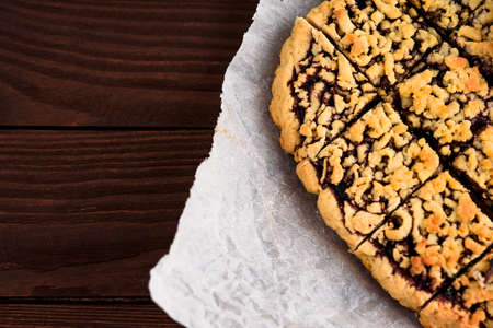 The cut cake on parchment in the right corner of the frame.の写真素材