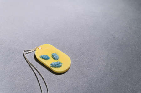 One Florentine Aromatic Sachet with Dried Flowers in form of an Oval on Gray Background. Aromatic...