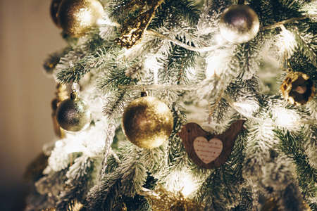 Close-up of Toys on Christmas Tree Close-up. Night Christmas tree. Noise Effect Screensaver. copy spaceの写真素材