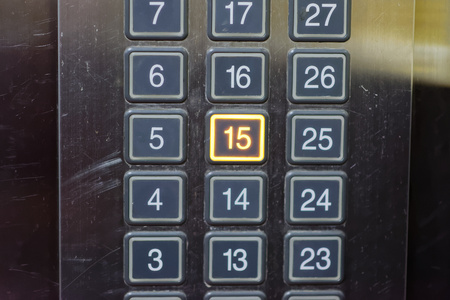 Elevator button with number 15 pushedの写真素材