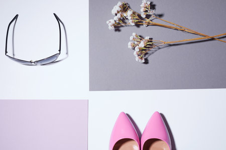 Elegant classic pink shoes. High heels. Cat eye retro sunglasses, flowersの写真素材