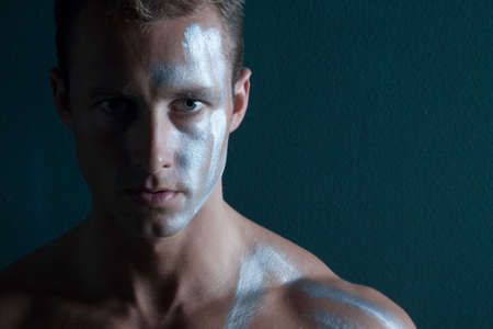Sexy man with face paintの写真素材