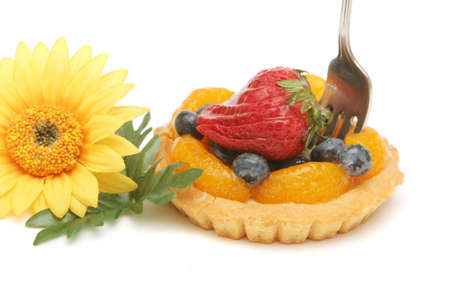 Fruit tart topped with berriesの写真素材