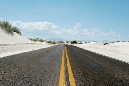 Desert road into the horizonの写真素材