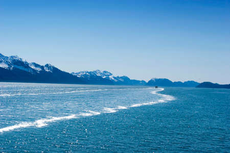 Snow melting on the mountainsの写真素材