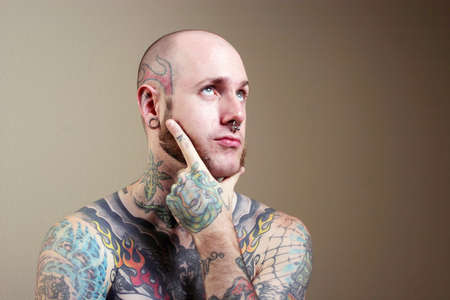 Portrait of a man covered in tattooの写真素材