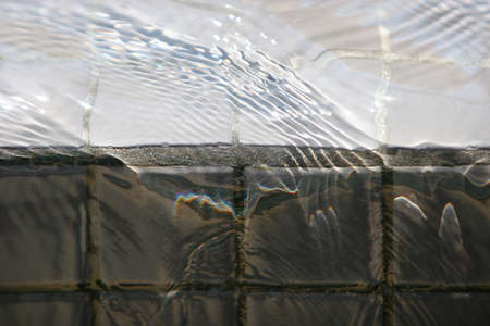 Water pouring over rocksの写真素材