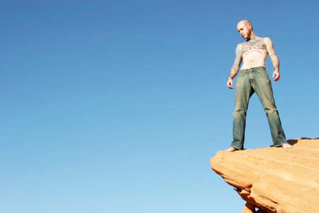 Tattoo man standing on edgeの写真素材