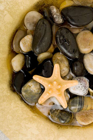 Spa stones in waterの写真素材