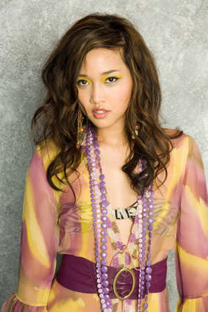Pretty asian woman in stylish dressの写真素材