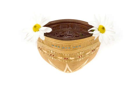 Daisies in a beautiful golden vaseの写真素材