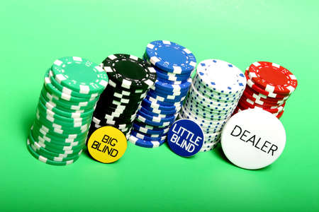 Poker chips and Texas hold'em buttons
