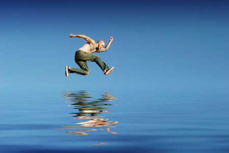 Man jumping on waterの写真素材