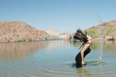 Beautiful sexy woman in lakeの写真素材