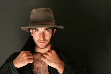 Man in hat and trench coat